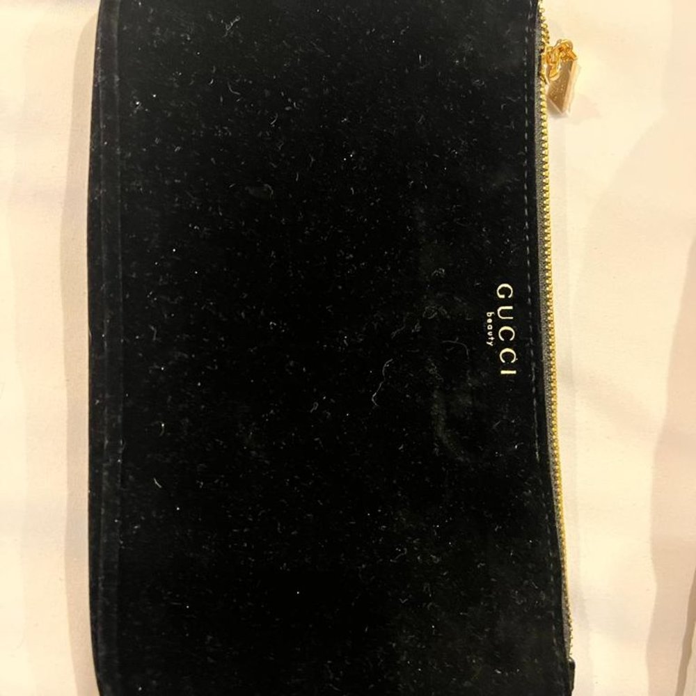 GUCCI POUCH BALCK VELVET , NEW WITH GOLD LOGO DETAIL ON ZIPPER